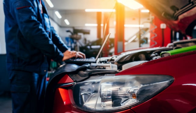 Man repairing a car